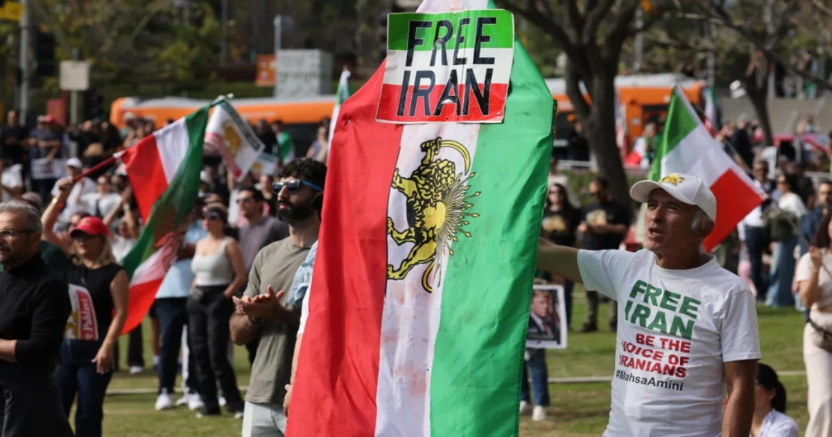 Iran Squad Lands In Los Angeles As Protesters Display Anti-Regime Banners